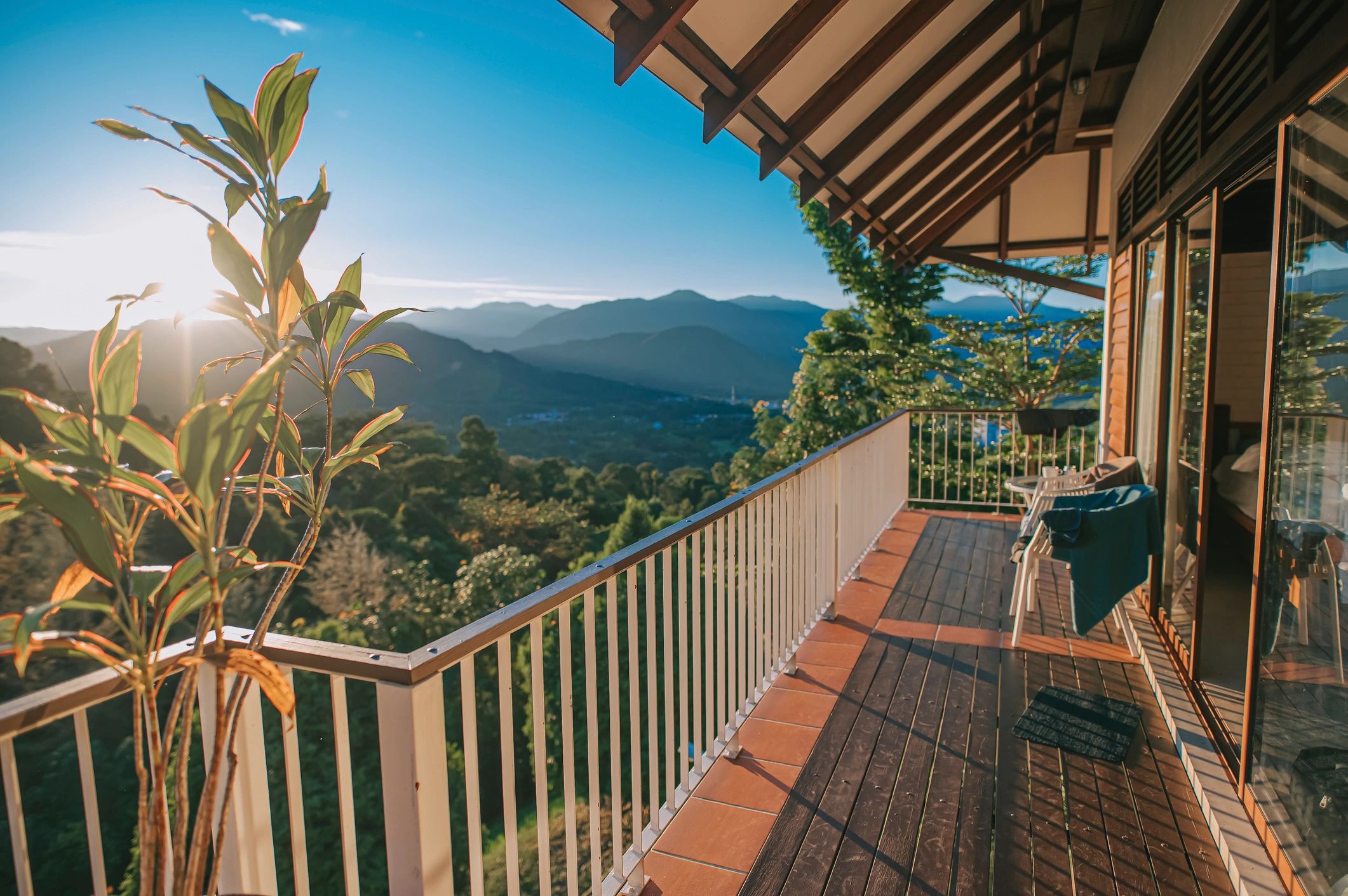 View from a balcony over mountains and forest at a resort