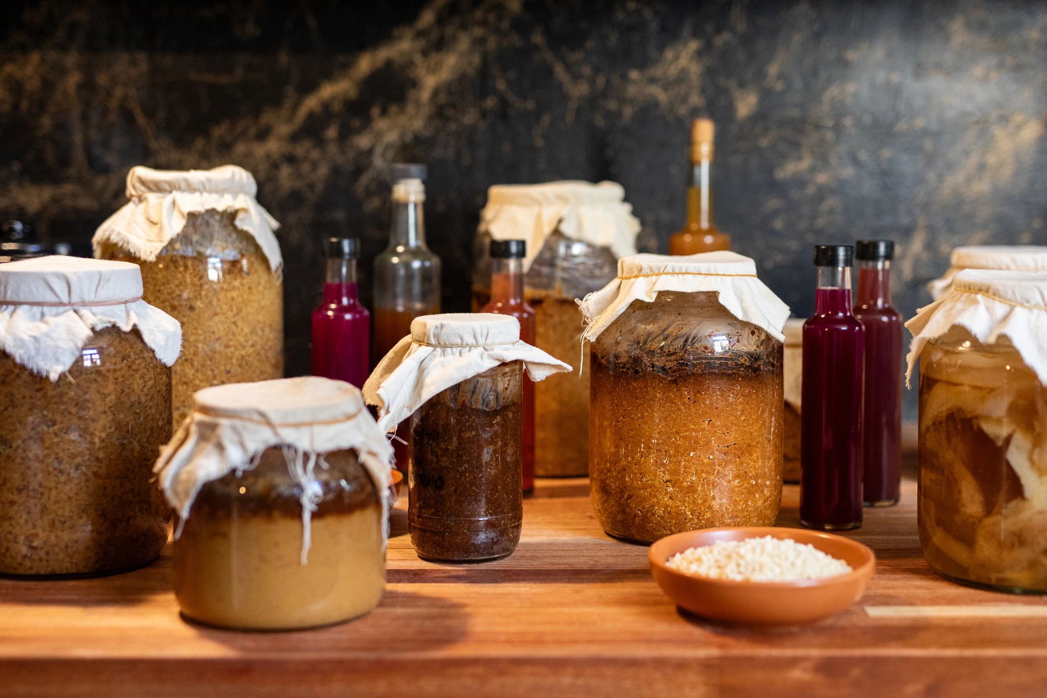 Fermented foods and jars, representing gut-supportive nourishment
