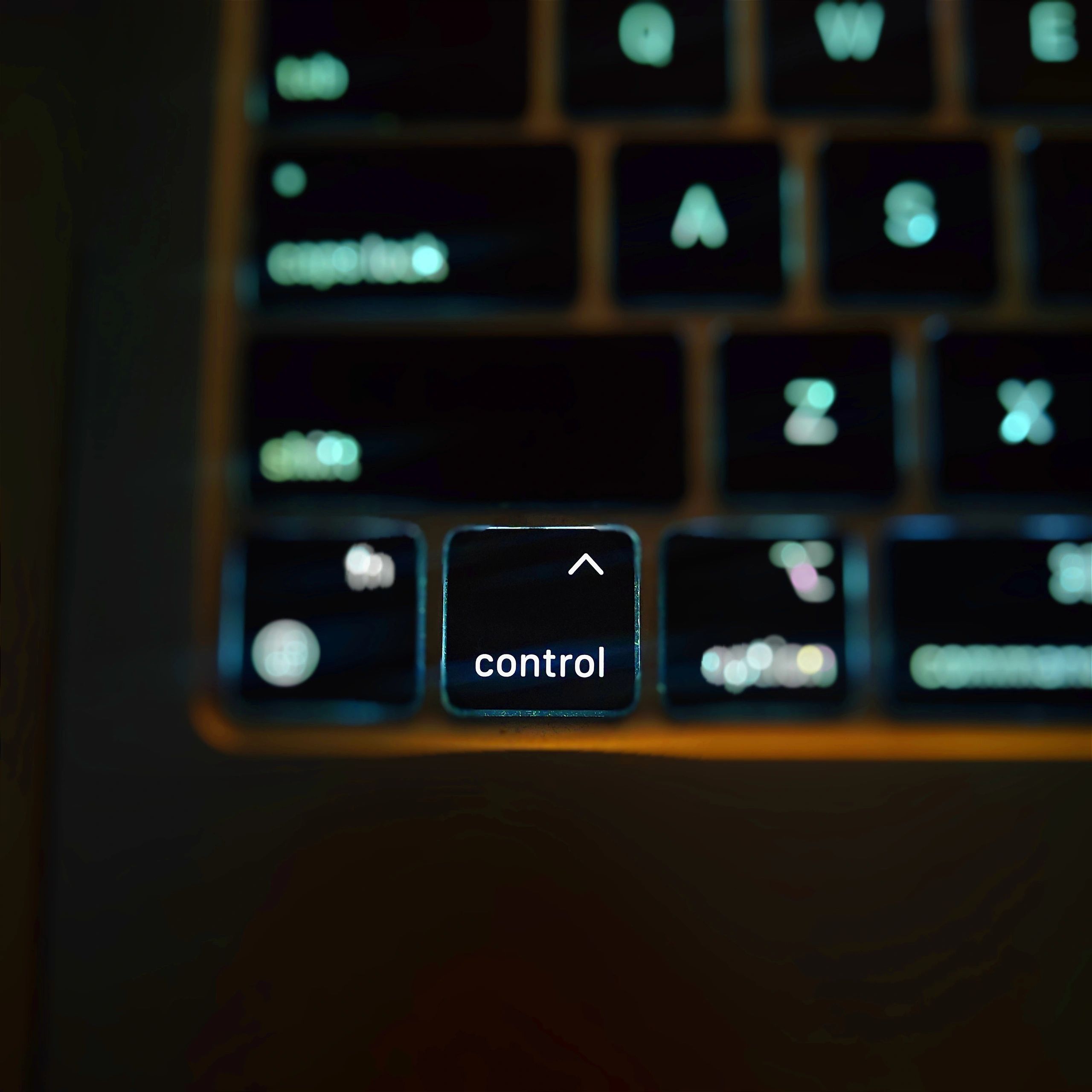 Hands typing an email on a laptop keyboard