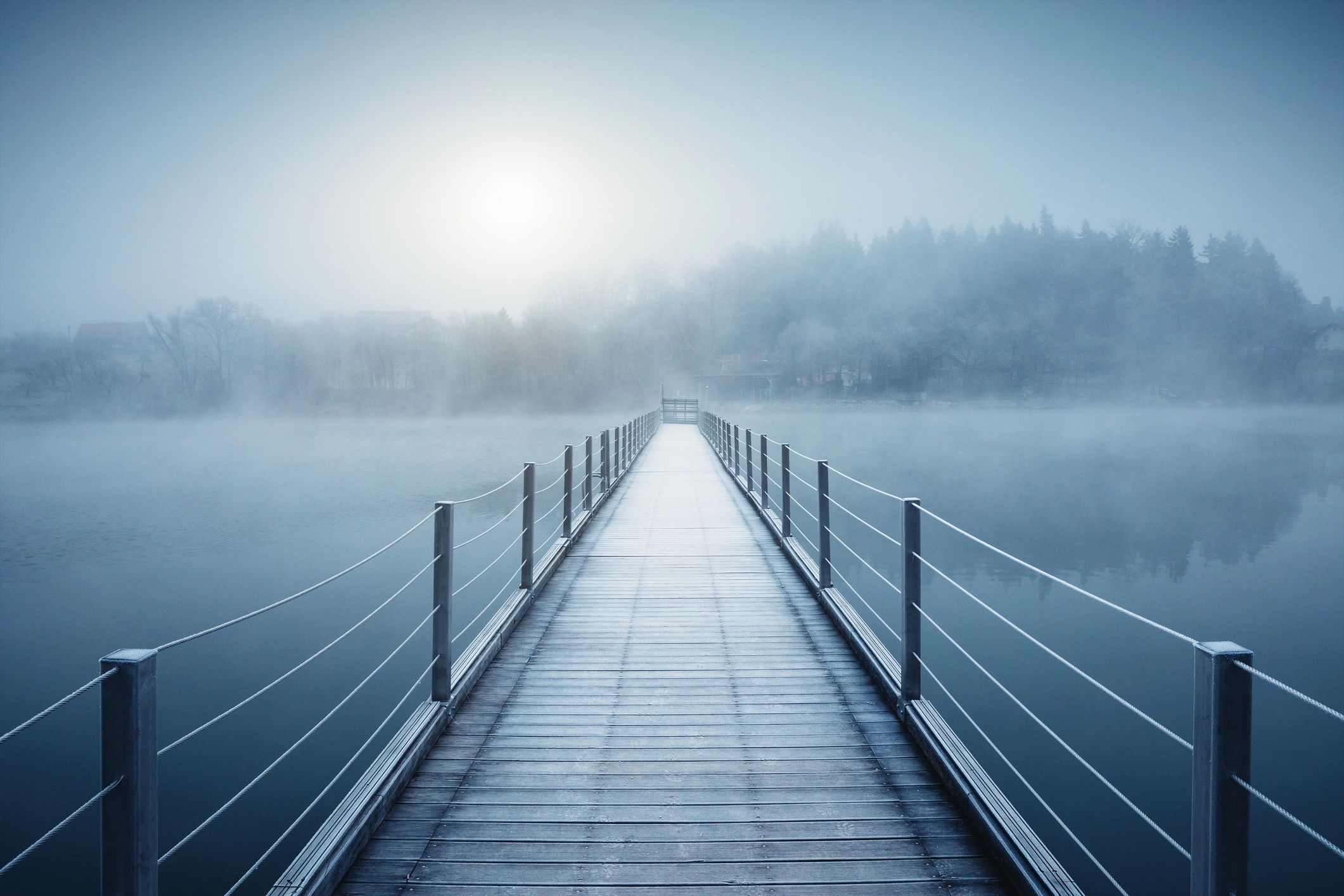 Footbridge over a lake at sunrise